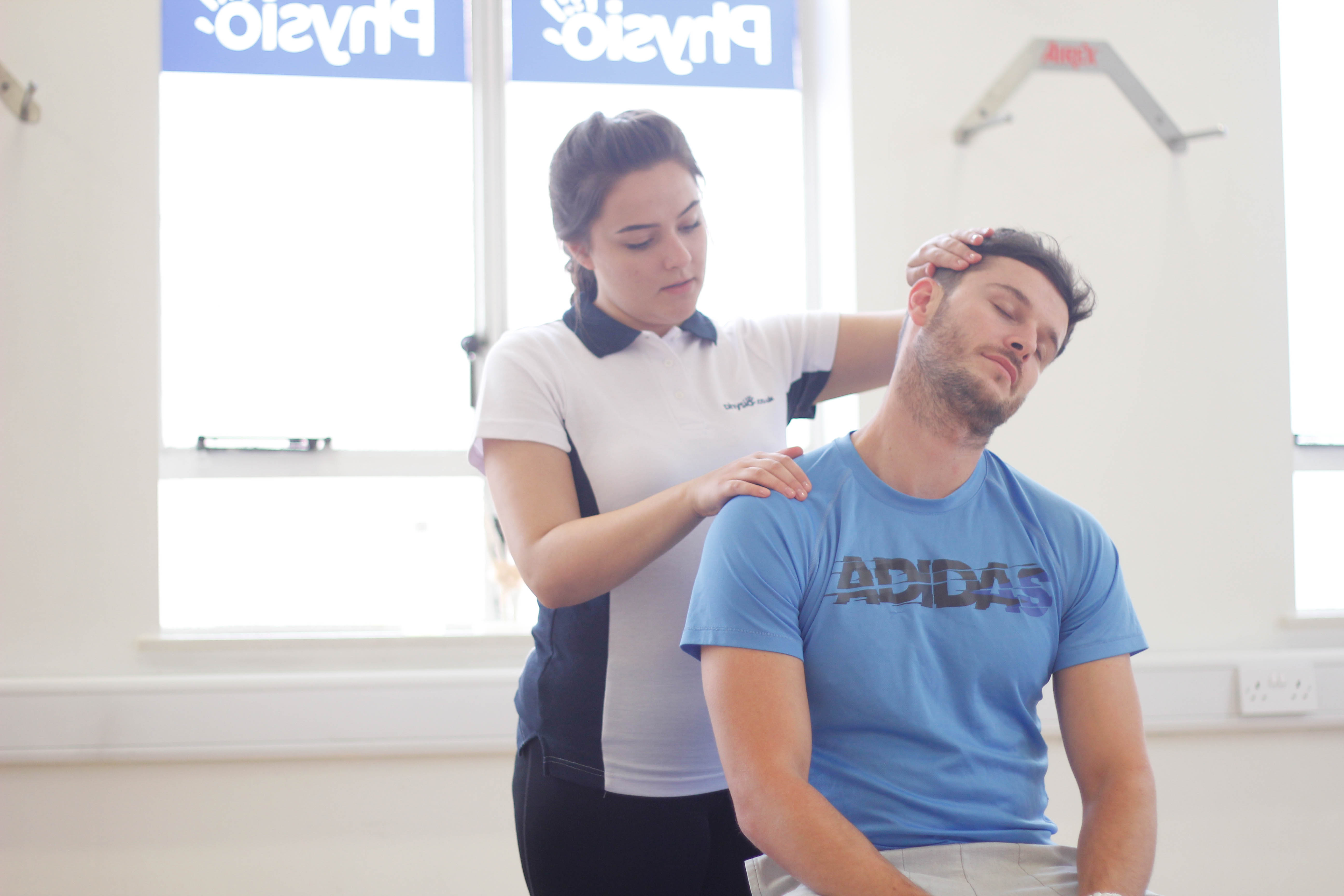 Patient receiving upper body massage in Manchester clinic