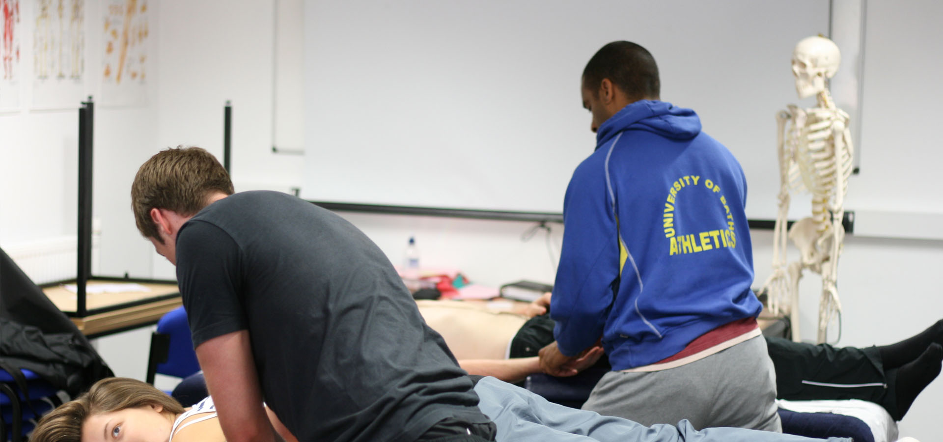 Course attendees practicing massage techniques