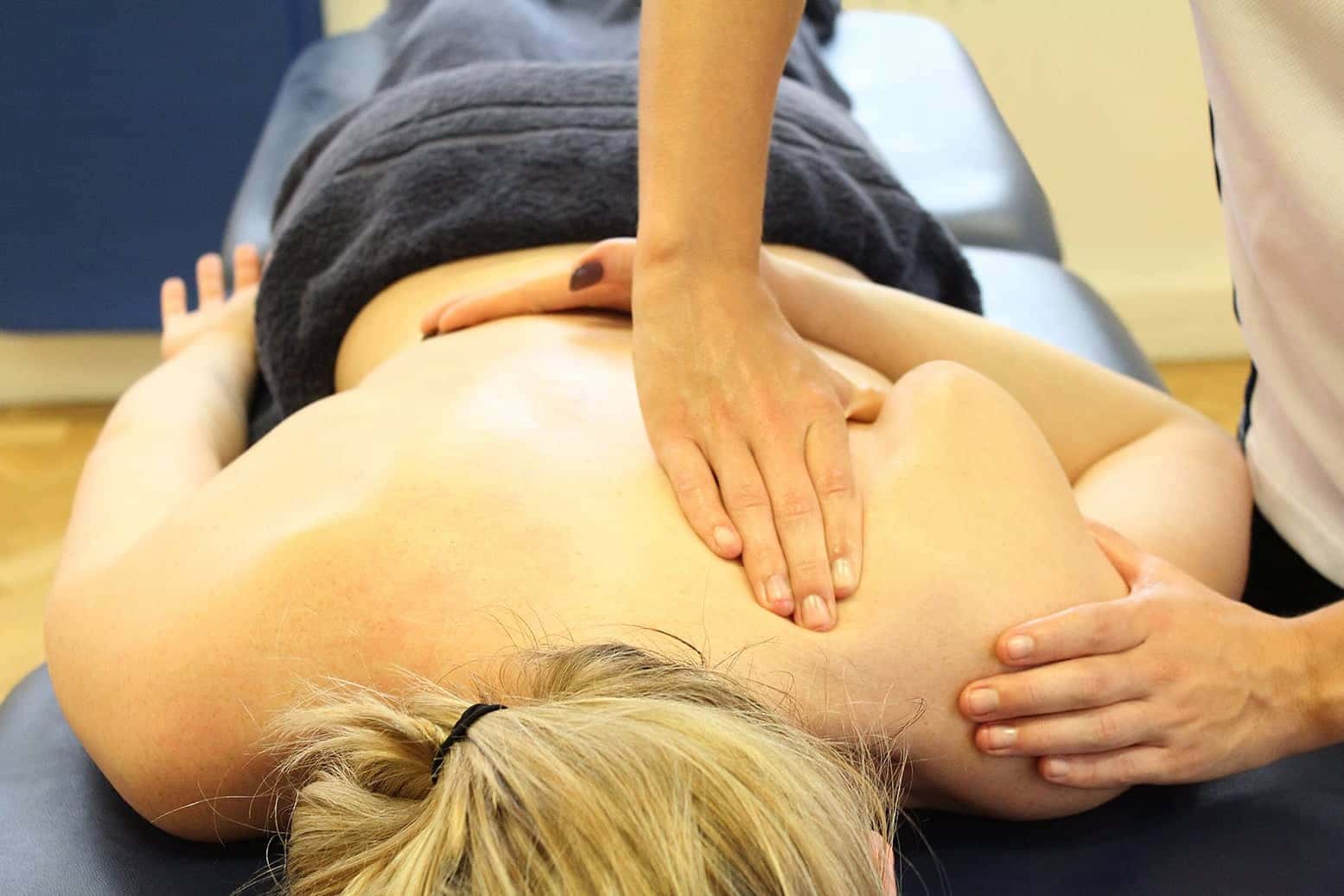 Patient receiving a deep tissue massage