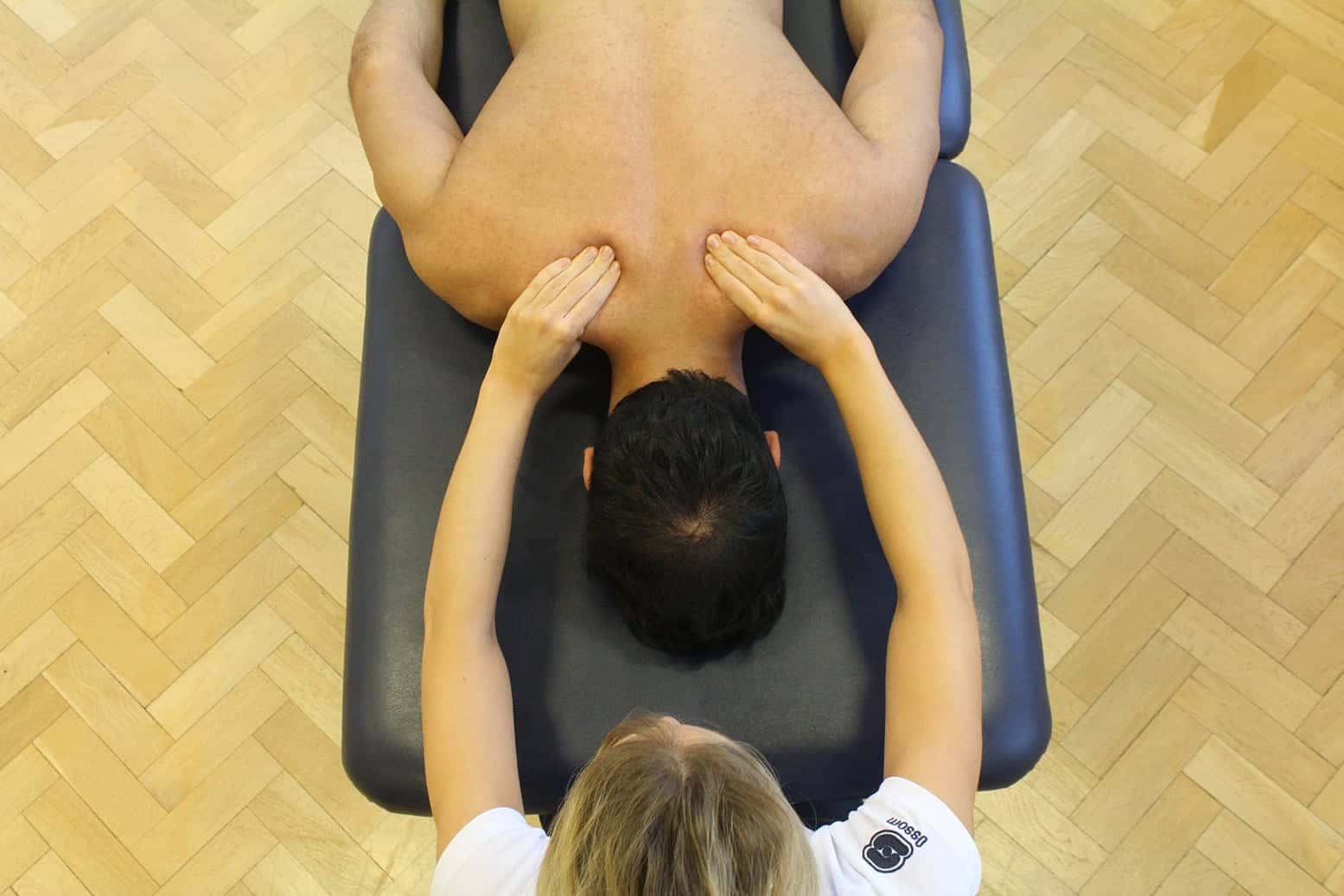 Patient receiving a postural massage